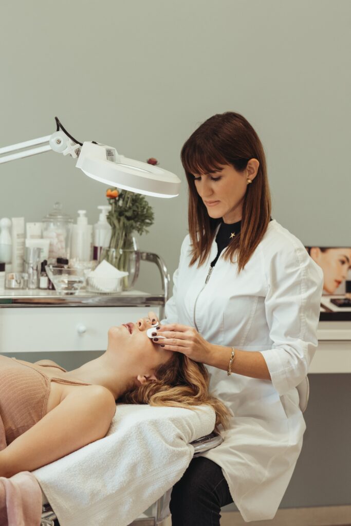 Cosmetologist Making Beauty Procedures to Woman in Salon