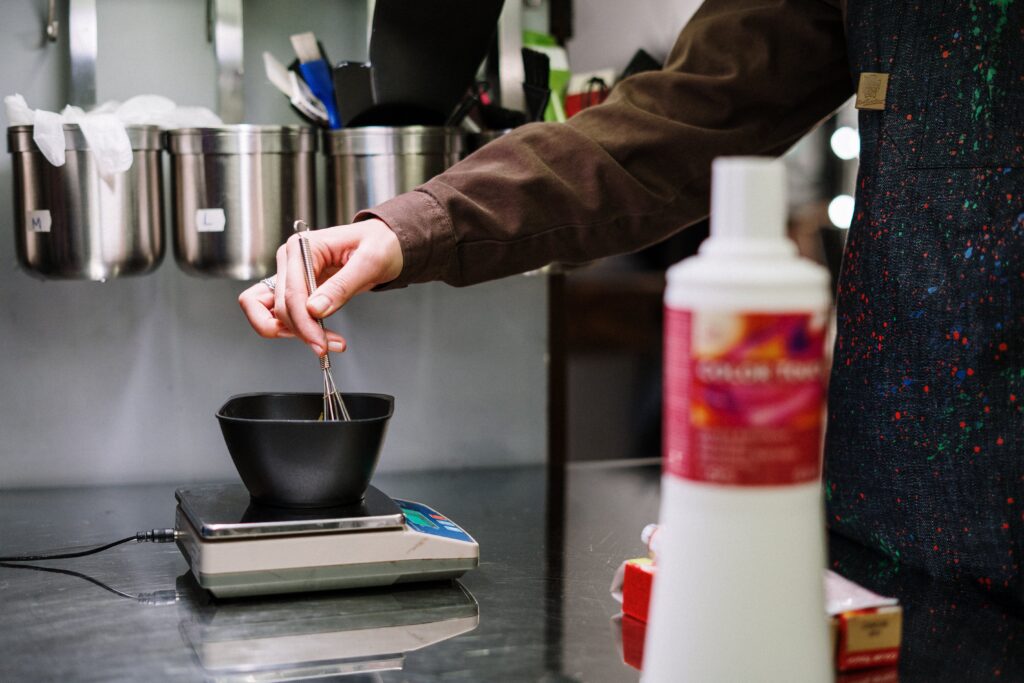 Person Holding Stainless Steel Spoon