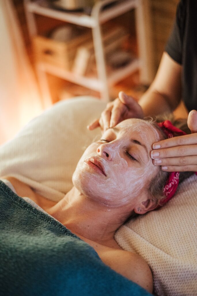 Female with mask on face in spa center